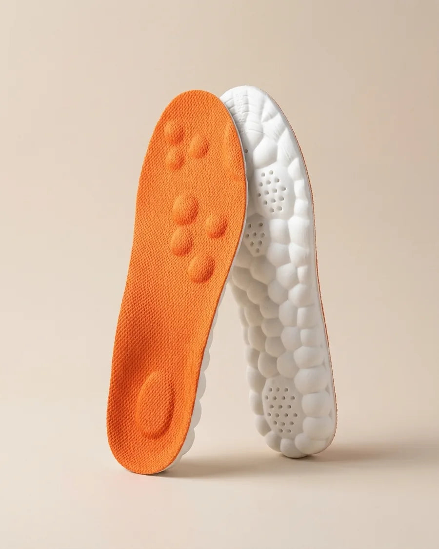 Massage-inlegzolen in oranje en wit, los tegen elkaar aan, wolkzachte onderlaag en massagenopjes zichtbaar